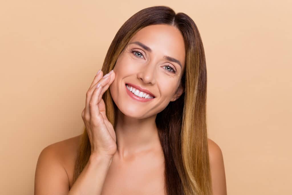 A woman smiling after a MOXI laser treatment in Denver A woman smiling after a MOXI laser treatment in Denver